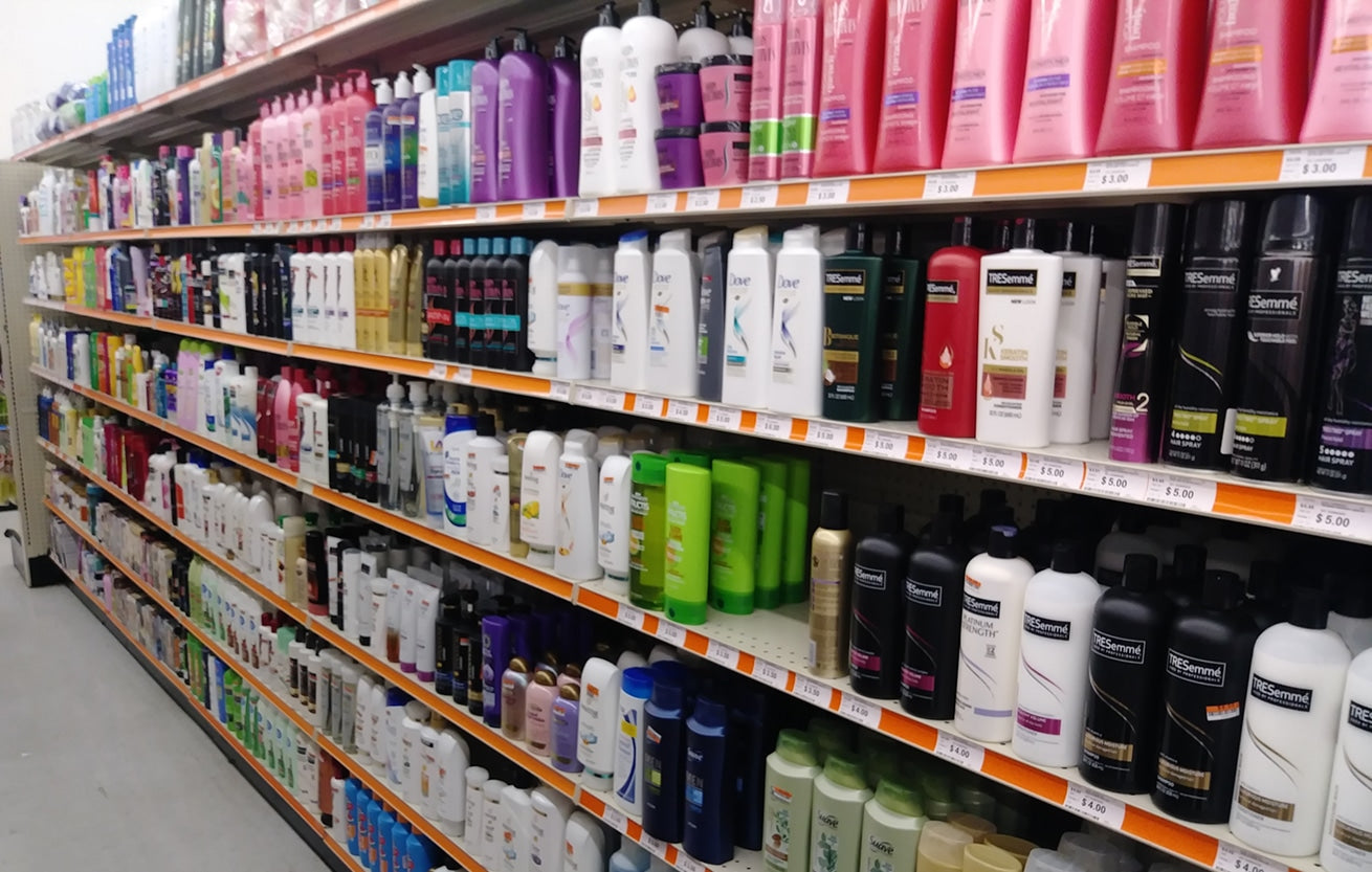 A drugstore aisle filled with personal-care and hair products